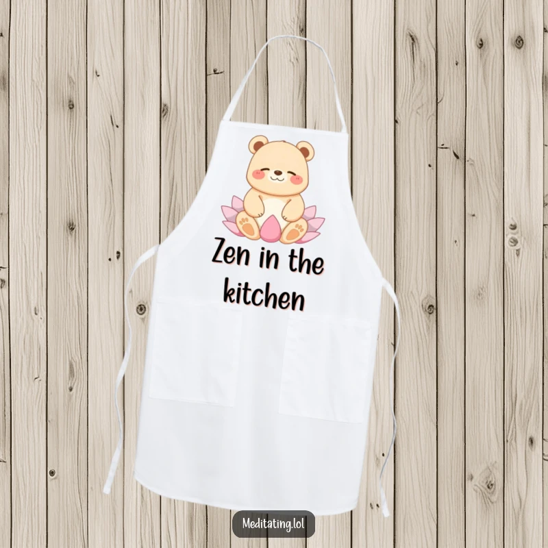 Funny apron showing a giggling bear in a peaceful lotus yoga position, bringing humorous zen to kitchen tasks.