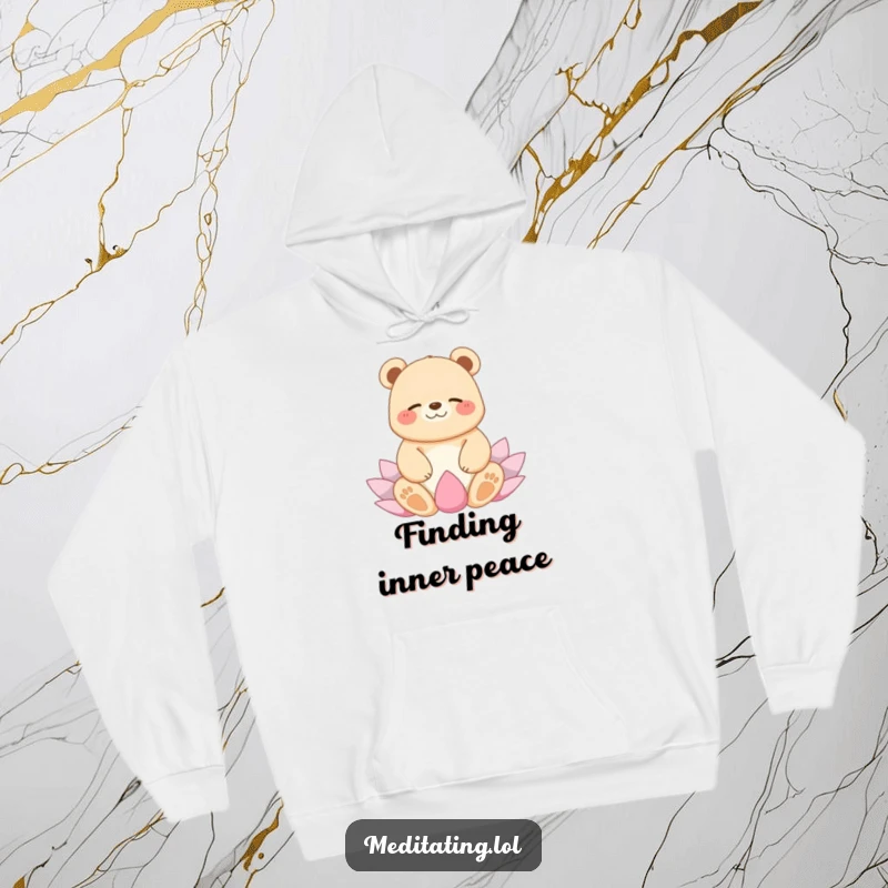 Funny hoodie depicting a joyful bear giggling peacefully in a lotus yoga position, offering comfort and humorous zen.