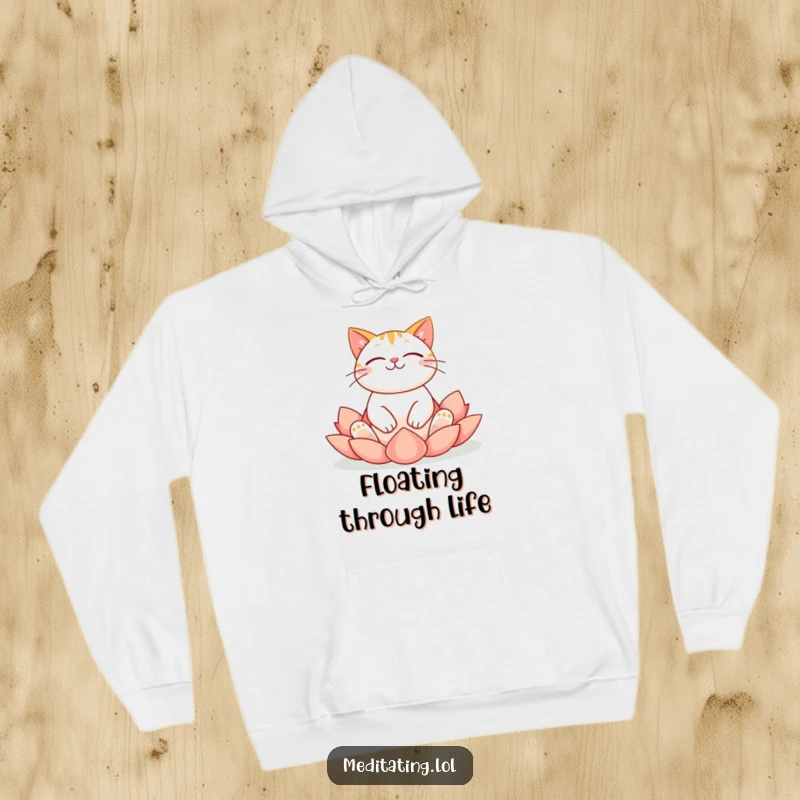 Funny cat hoodie depicting a cheerful cat meditating peacefully in a lotus yoga position, offering cozy mindfulness.