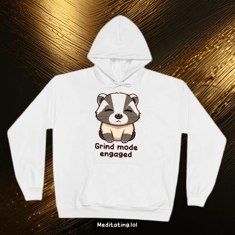 Funny hoodie featuring a determined badger meditating with eyes closed, taking a deep breath to achieve peak concentration.
