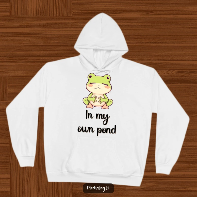 Funny hoodie graphic of a frog gently meditating mid-bounce, exuding calm and peaceful vibes.