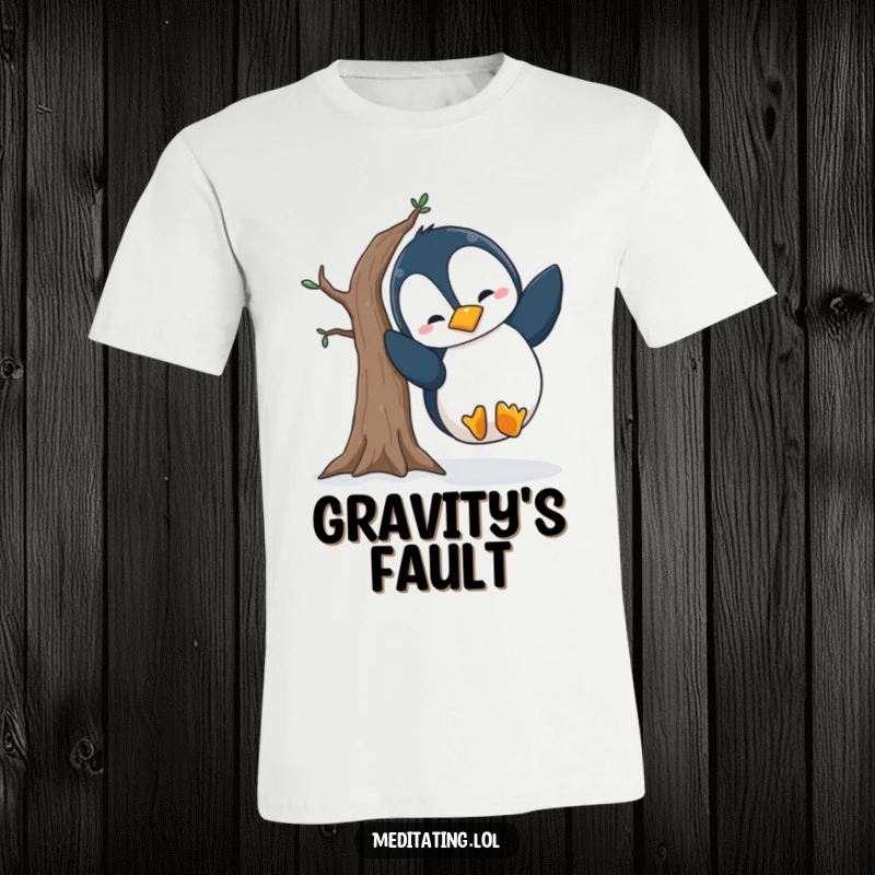 Funny penguin t-shirt depicting a silly penguin losing its balance during a wobbly tree pose, ideal for spreading laughter and cheer.